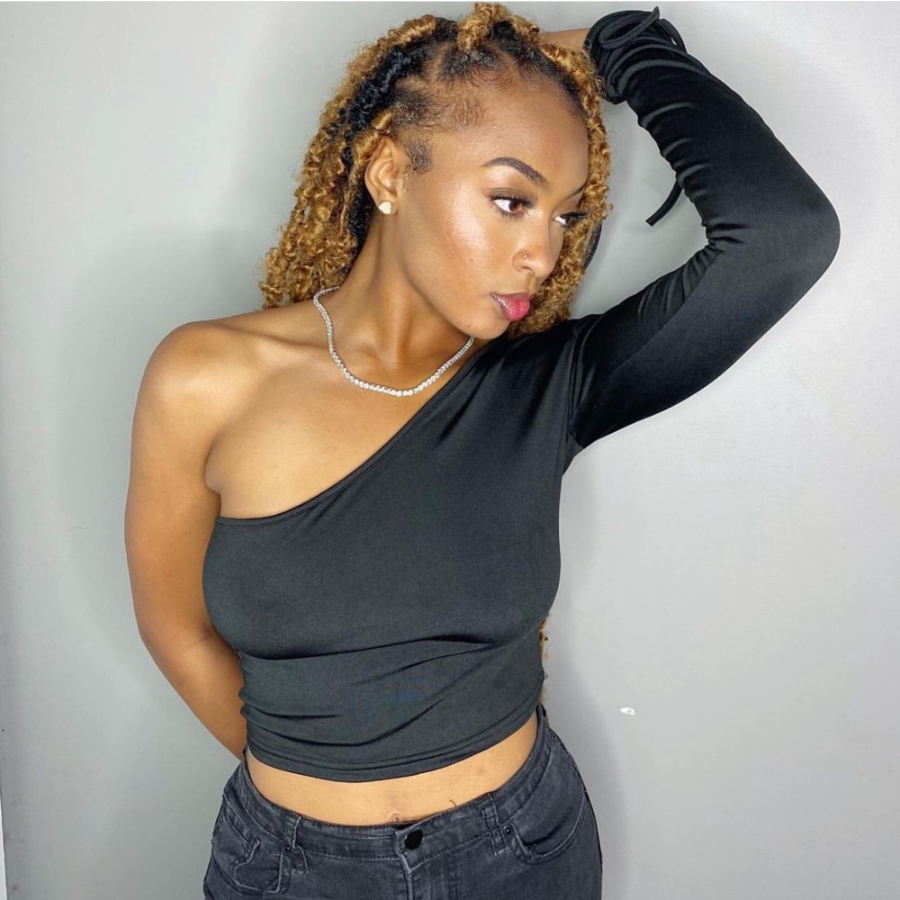 Long one sleeve black crop top.